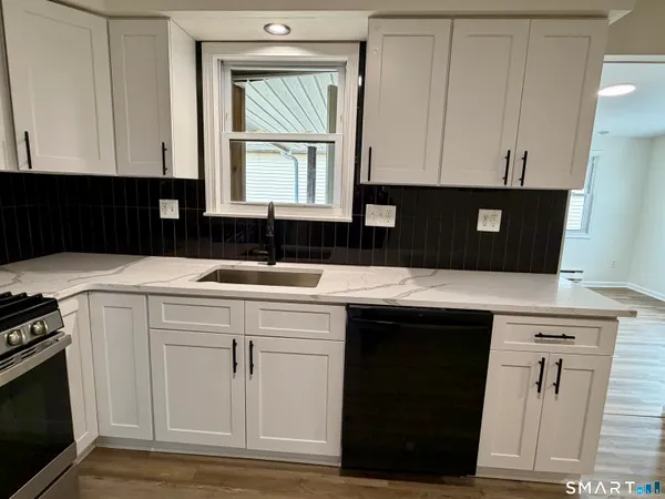 a kitchen with a sink and cabinets