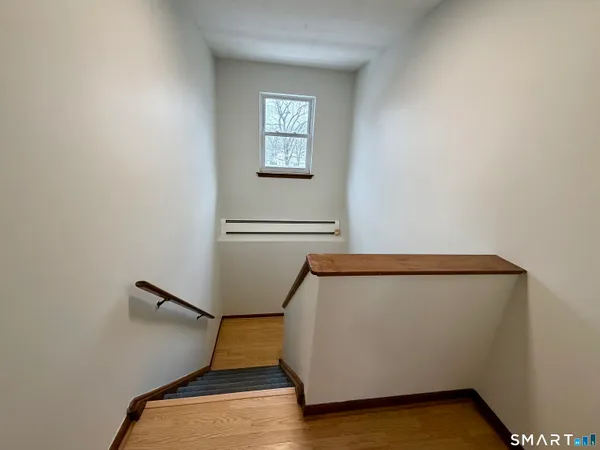 a view of an empty room with windows