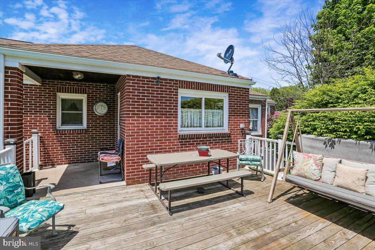 321 North 3rd Street Oakland, MD 21550 - Photo 4 of 48 a backyard of a house with barbeque oven table and chairs