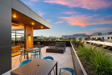 a view of roof deck with patio