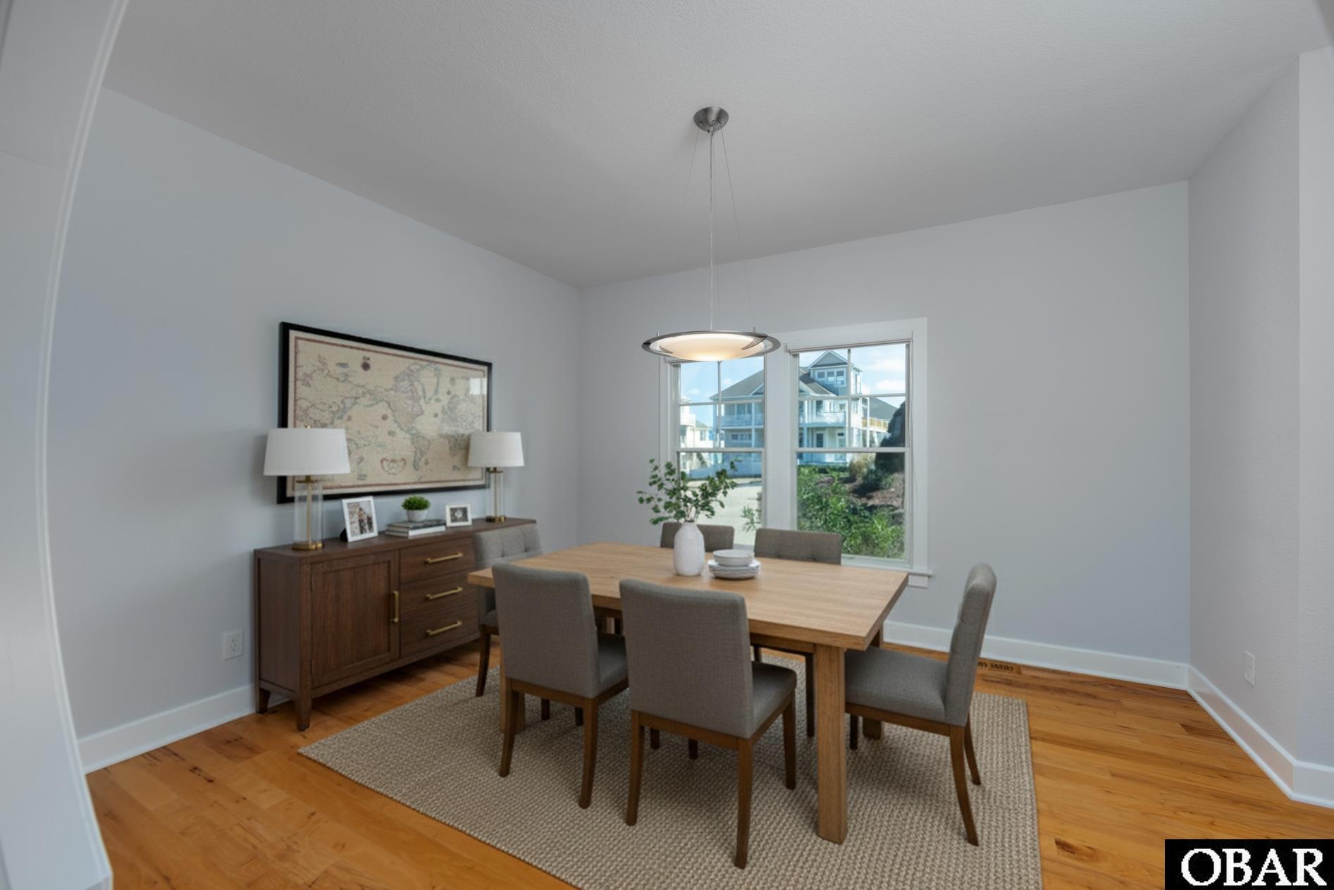 748 Dune Point Road Corolla, NC 27927 - Photo 15 of 44 Virtually staged dining