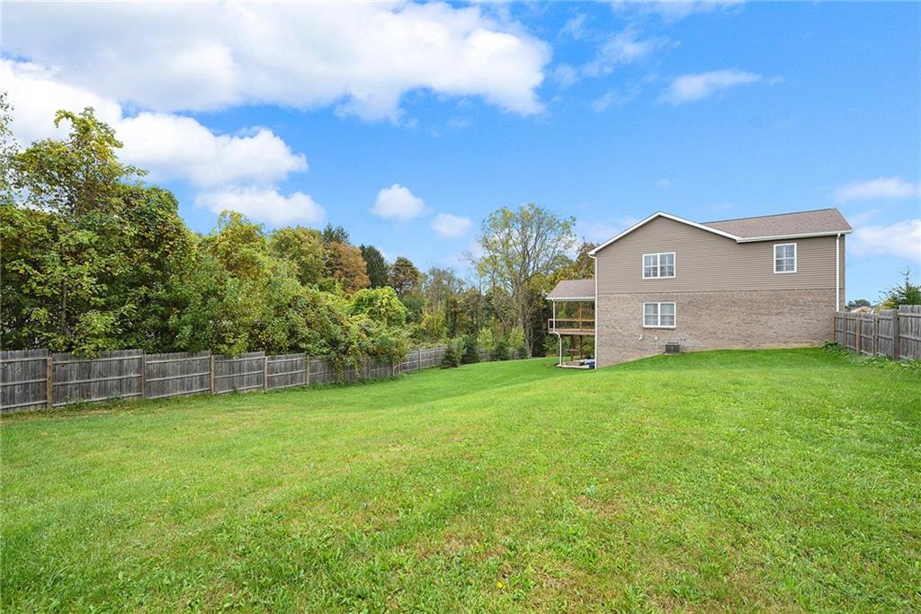103 Timothy Trail Beaver, PA 15009 - Photo 25 of 25 a view of a house with a big yard and large trees