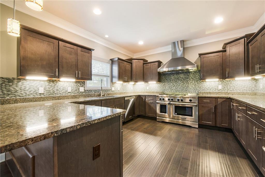103 Timothy Trail Beaver, PA 15009 - Photo 4 of 25 a kitchen with stainless steel appliances granite countertop a stove a sink and a microwave