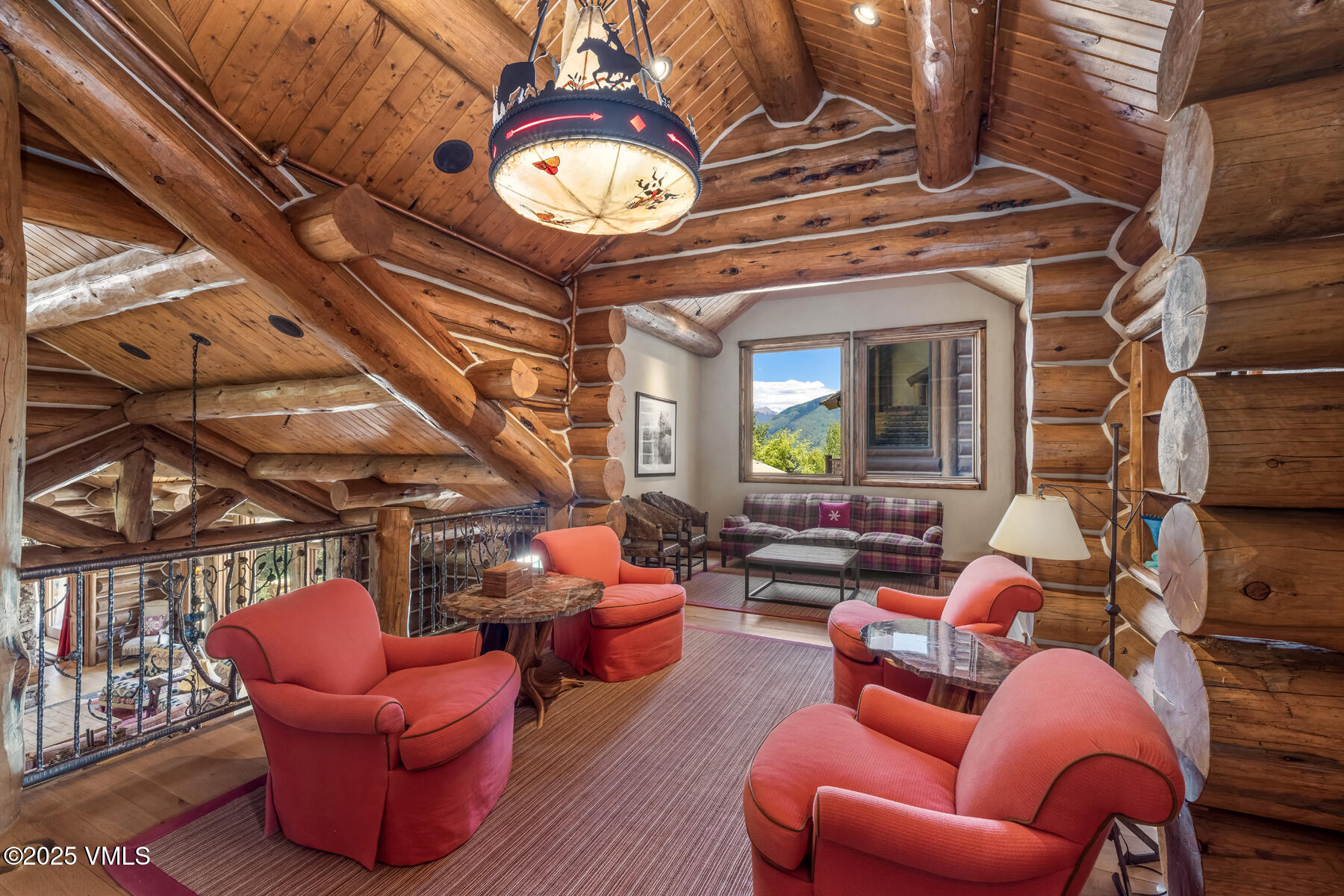 1452 Buffehr Creek Road Vail, CO 81657 - Photo 39 of 66 a living room with furniture a chandelier and a clock