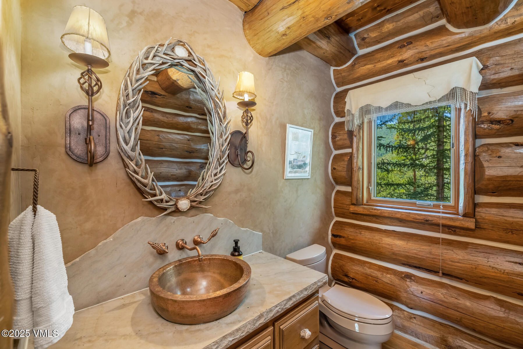 1452 Buffehr Creek Road Vail, CO 81657 - Photo 44 of 66 a bathroom with a granite countertop sink and a mirror
