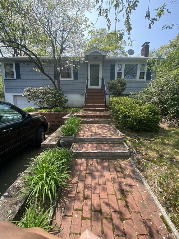 68 Thayer Circle Randolph, MA 02368 - Photo 1 of 25 a front view of a house with a yard