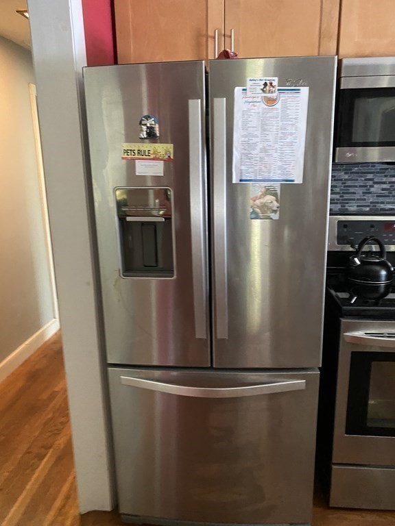 68 Thayer Circle Randolph, MA 02368 - Photo 11 of 25 a close view of a refrigerator in kitchen and a stove