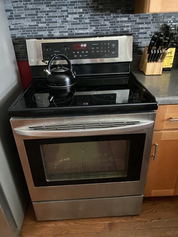 68 Thayer Circle Randolph, MA 02368 - Photo 12 of 25 a stove top oven sitting inside of a kitchen