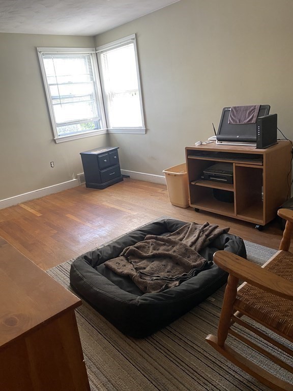 68 Thayer Circle Randolph, MA 02368 - Photo 19 of 25 a bed sitting in a bedroom next to a window