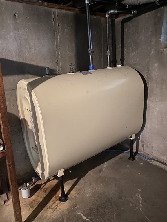 68 Thayer Circle Randolph, MA 02368 - Photo 22 of 25 a bedroom with a bed and gym machine