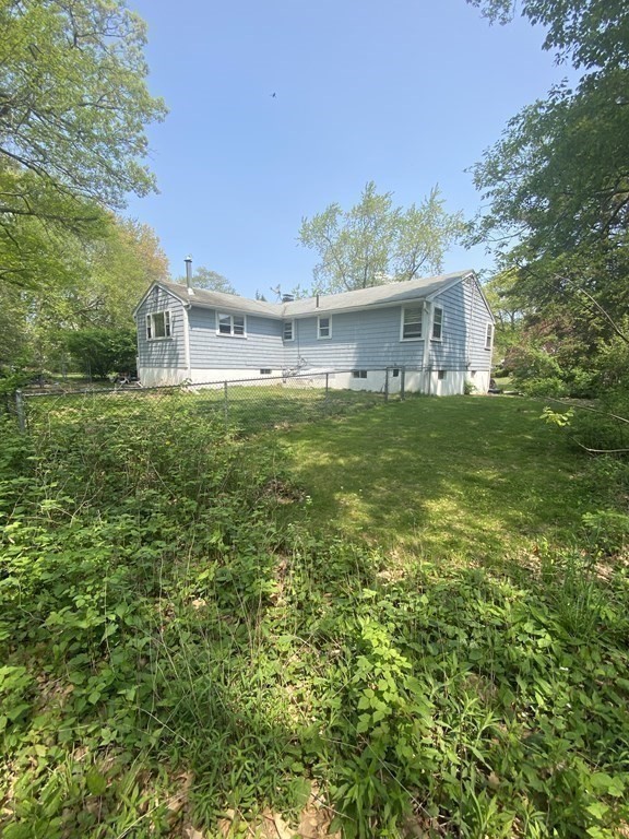 68 Thayer Circle Randolph, MA 02368 - Photo 23 of 25 a view of a big house with a big yard and large trees