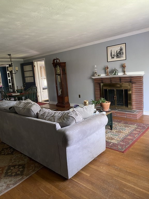 68 Thayer Circle Randolph, MA 02368 - Photo 4 of 25 a living room with furniture and a fireplace