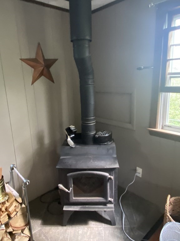 68 Thayer Circle Randolph, MA 02368 - Photo 8 of 25 a fireplace with a desk in it