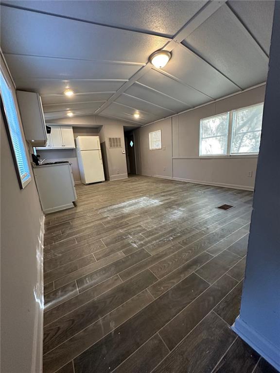 114 Skyland Drive East Locust Grove, GA 30248 - Photo 3 of 10 a view of an empty room with windows