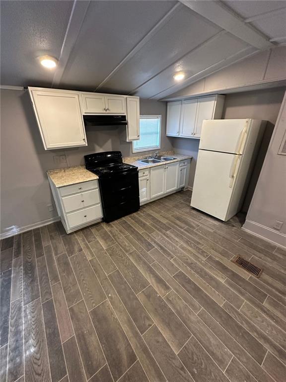 114 Skyland Drive East Locust Grove, GA 30248 - Photo 4 of 10 a large kitchen with a stove a sink and a refrigerator
