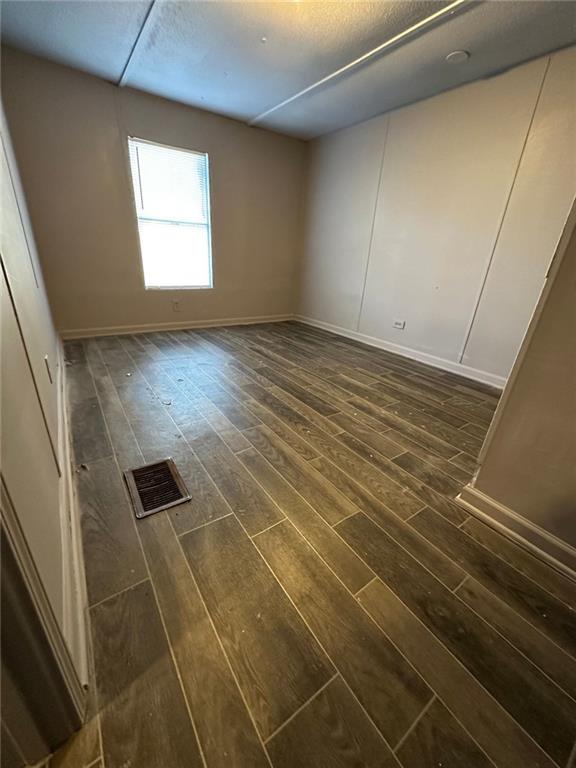 114 Skyland Drive East Locust Grove, GA 30248 - Photo 5 of 10 a view of an empty room with a window