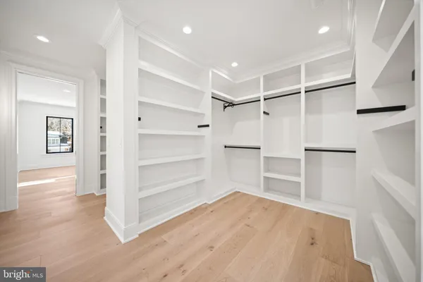a view of cabinets with wooden floor
