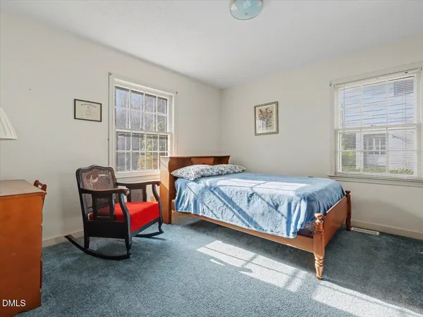 a bedroom with a bed and a closet