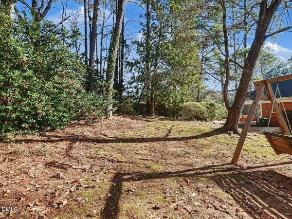 a view of house with trees in the background