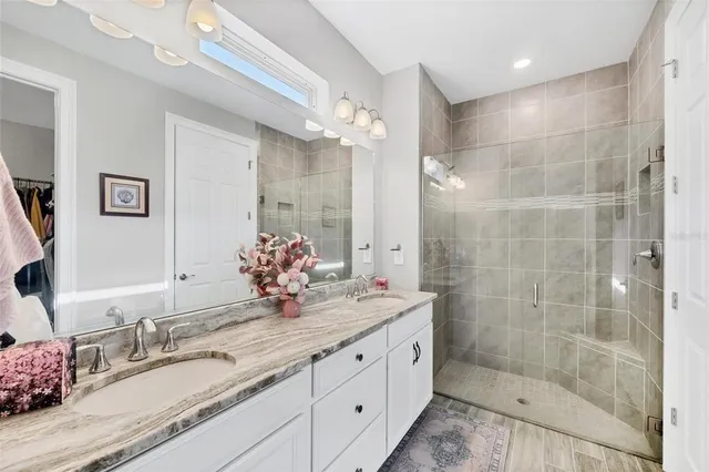 a view of a livingroom with a large window with wooden floor