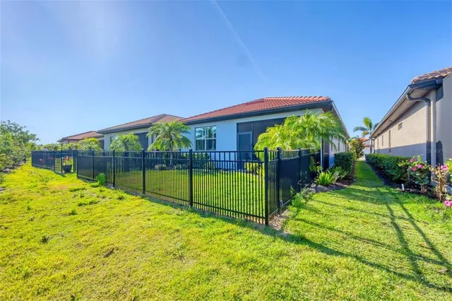an aerial view of a house with a ocean view