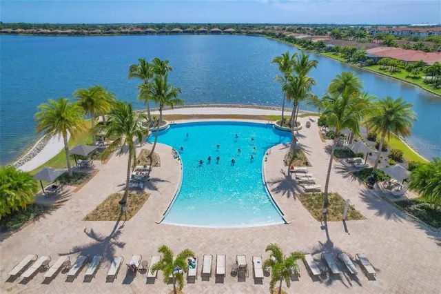 an aerial view of a house with a ocean view