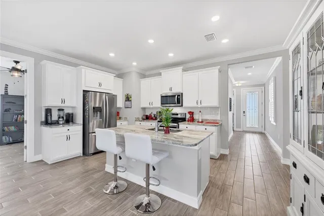 a kitchen with a sink stove and refrigerator