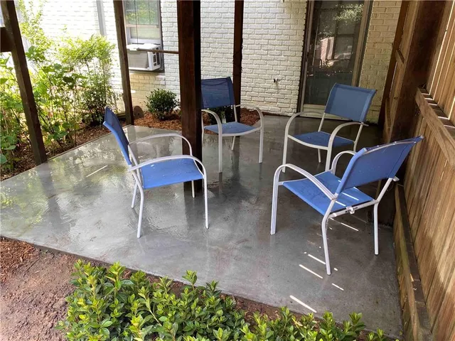 a couple of chairs sitting in front of a building