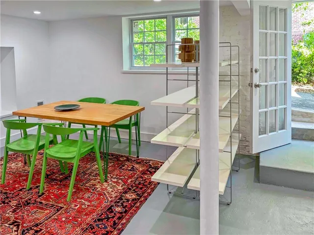 a balcony with chairs and table