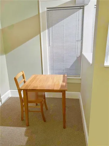 a view of a room with table and chair