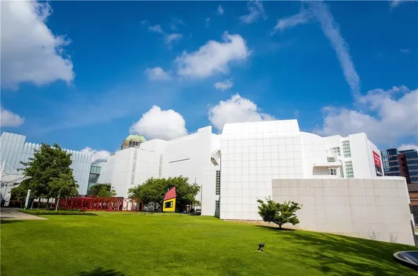 a front view of a building with garden