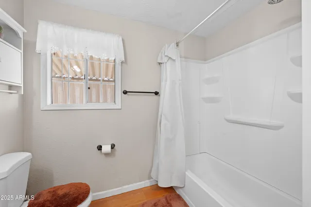 a bathroom with a tub and shower