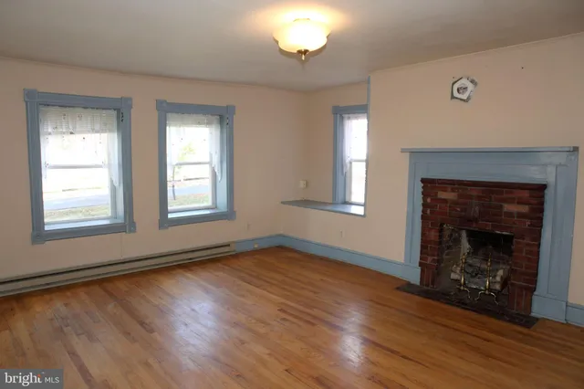 a white toilet sitting next to a shower