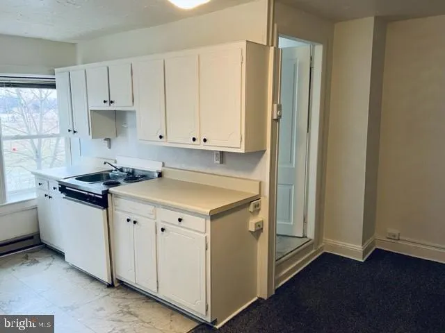 a view of a livingroom with furniture and wooden floor