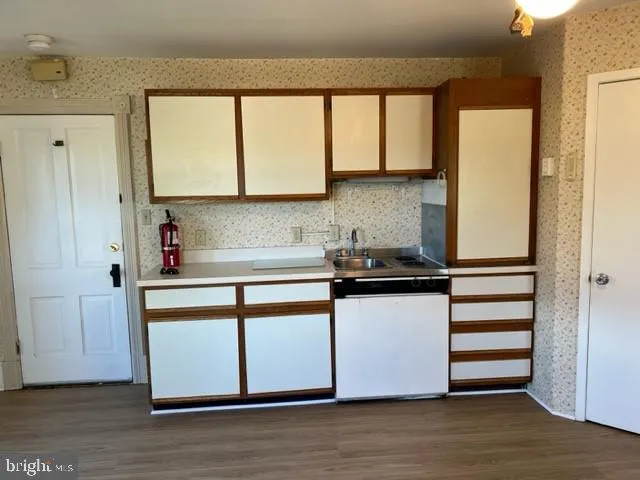 a kitchen with a stove and a microwave