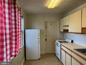 a view of a car park in front of house