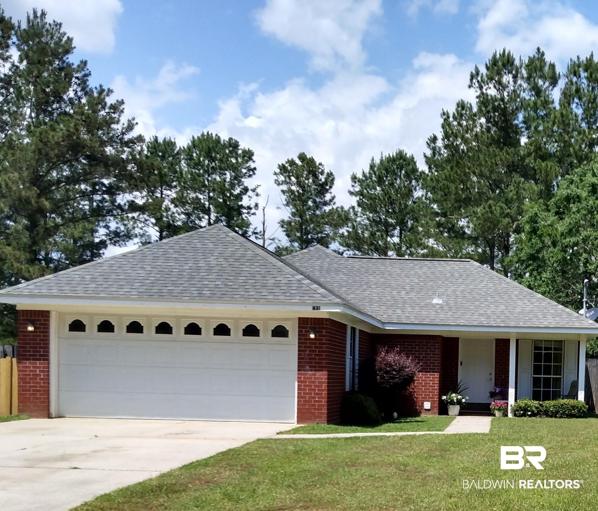 431 Hamilton Boulevard Foley, AL 36535 - Photo 1 of 30 Front of house with double-car garage, driveway and front porch walkway.