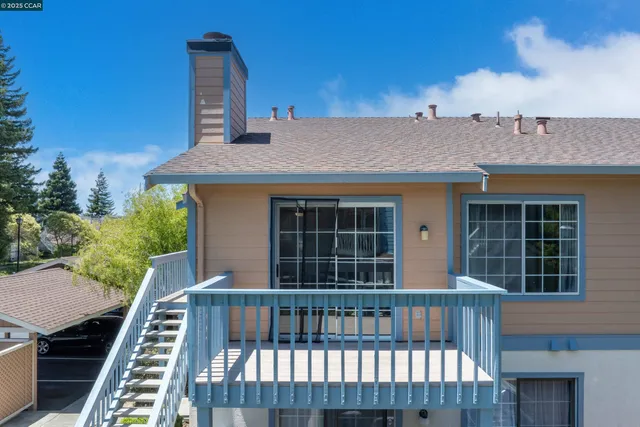 a view of a balcony with wooden floor