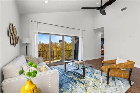 a bedroom with a bed and a couch