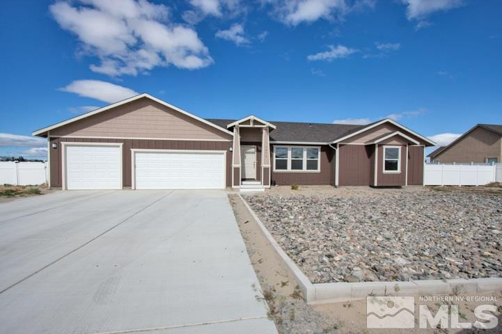1475 Sky Ridge Drive Fallon, NV 89406 - Photo 1 of 1 a front view of a house with a yard and garage