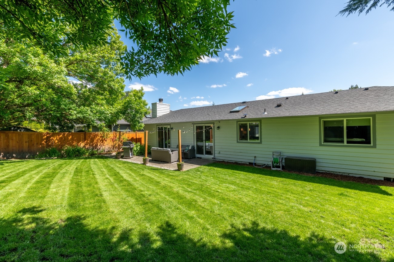 1301 234th Street Southwest Bothell, WA 98021 - Photo 14 of 21 a view of a house with a yard and sitting area