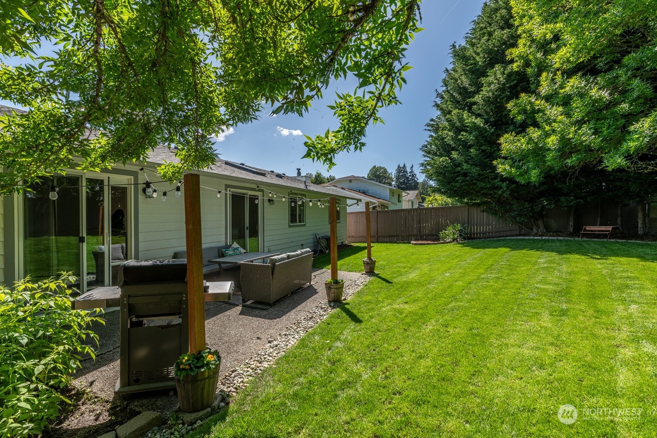 1301 234th Street Southwest Bothell, WA 98021 - Photo 15 of 21 a front view of a house with garden