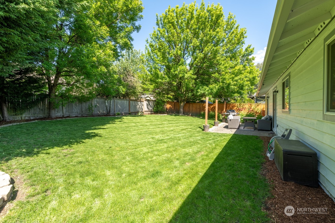 1301 234th Street Southwest Bothell, WA 98021 - Photo 17 of 21 a view of a yard with plants and large trees