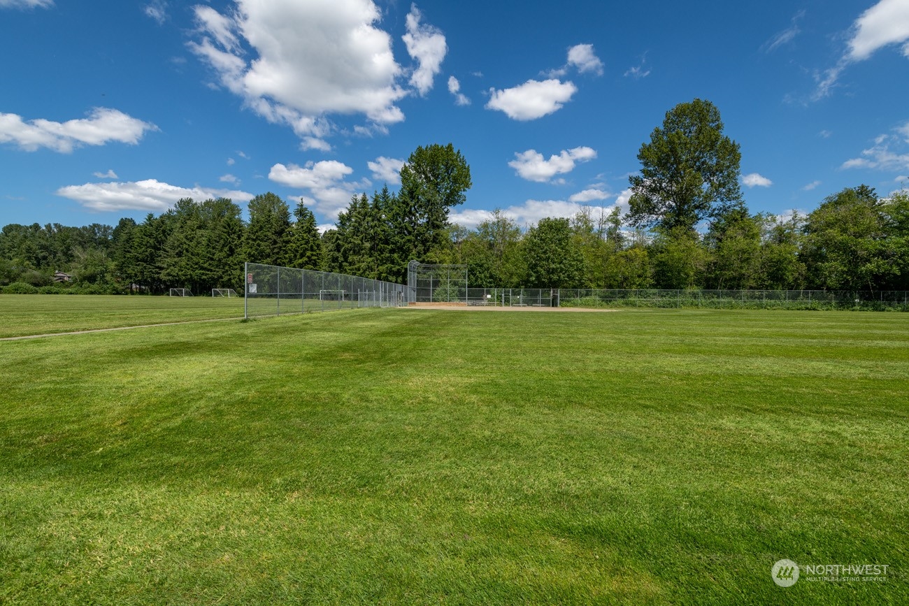 1301 234th Street Southwest Bothell, WA 98021 - Photo 19 of 21 a view of a field with a big yard