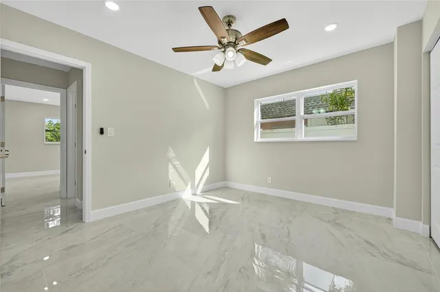 a view of an empty room with a window