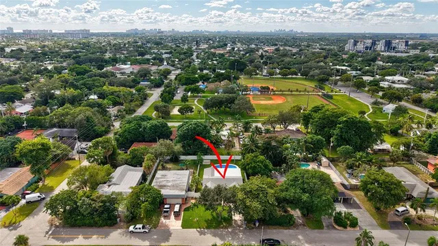 an aerial view of residential building and lake