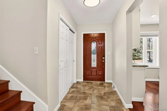 a bed room with a bed and a mirror