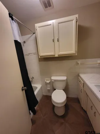 a bathroom with a toilet
