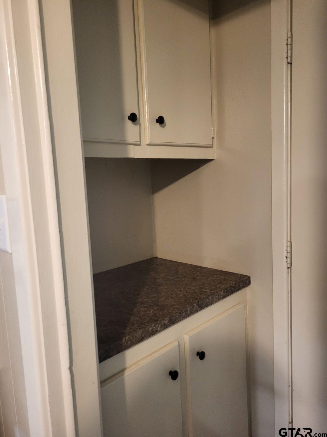 600 Cypress Street Pittsburg, TX 75686 - Photo 23 of 31 a view of a microwave oven