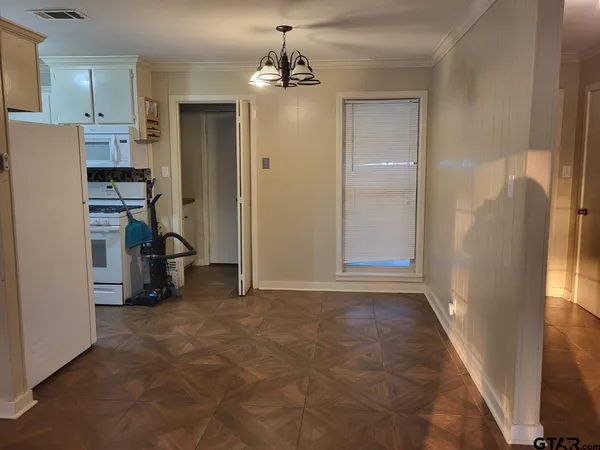 a view of a room with closet and windows